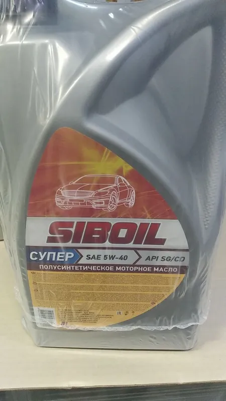 Серая канистра Siboil Супер 5W-40, на этикетке API SG/CD и надпись полусинтетическое моторное масло